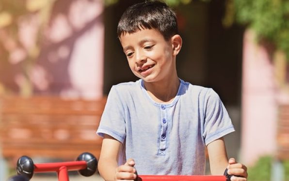 young-boy-having-fun-playground 1-min (1)